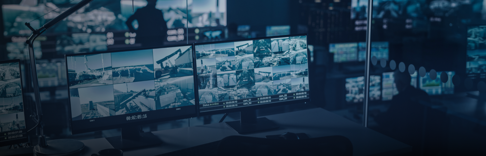 Two Digital Computer Screens with Surveillance CCTV Video in a Harbour Monitoring Center with Multiple Cameras on a Big Digital Screen. Employees Sit in Front of Displays with Big Data